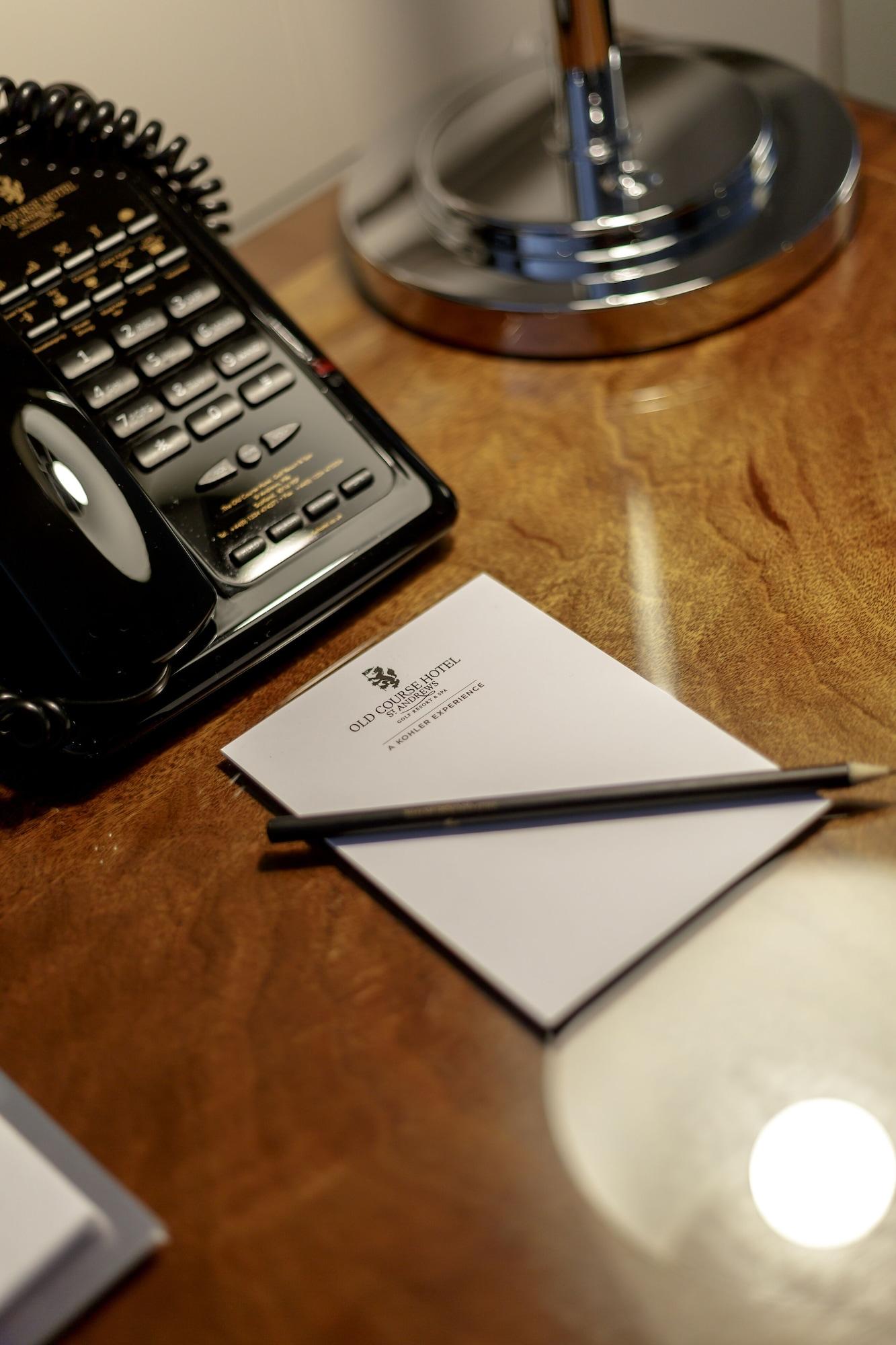 Old Course Hotel St Andrews Esterno foto A telephone and a notepad